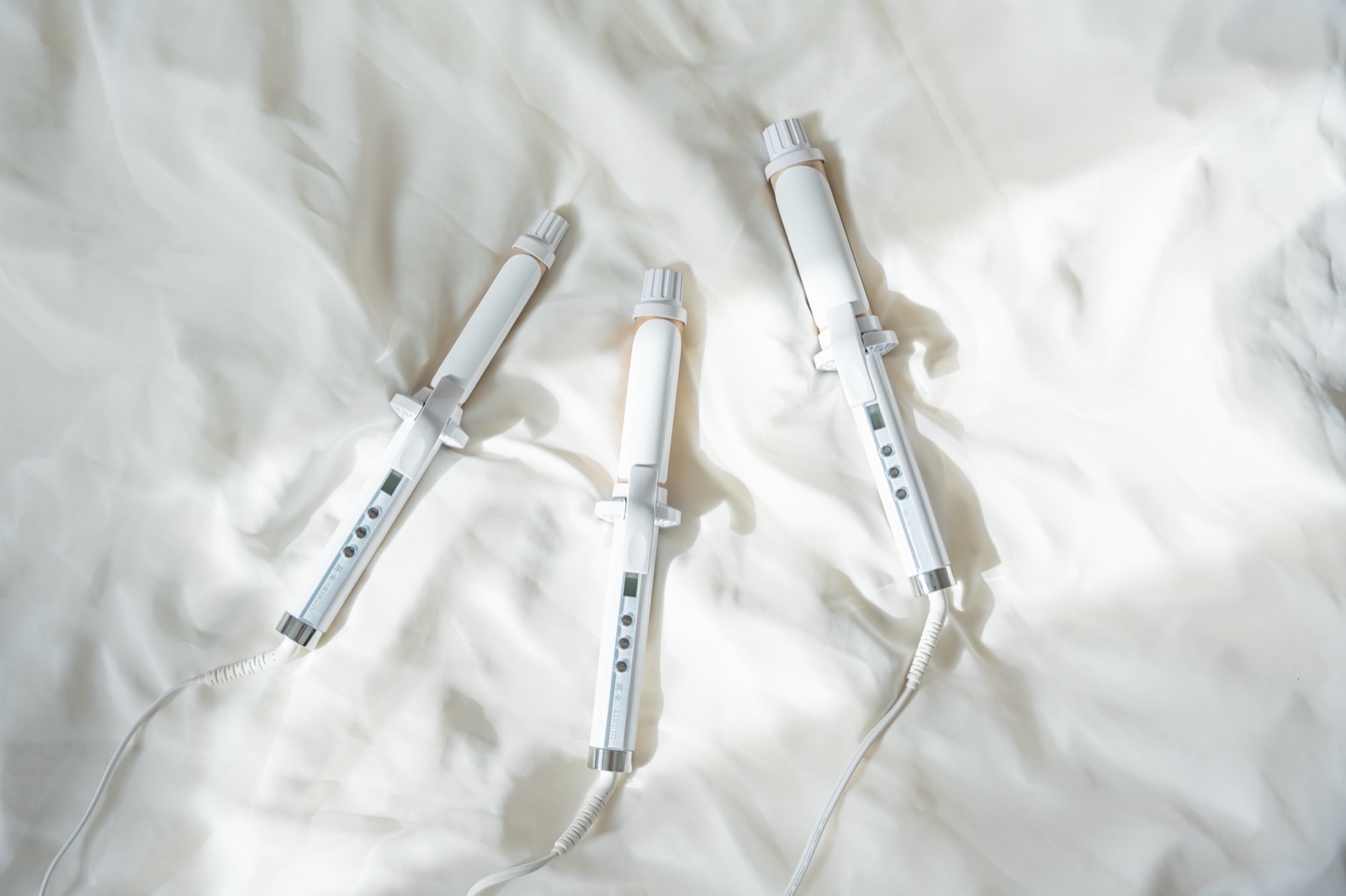 KINUJO Curl Iron on silk sheets